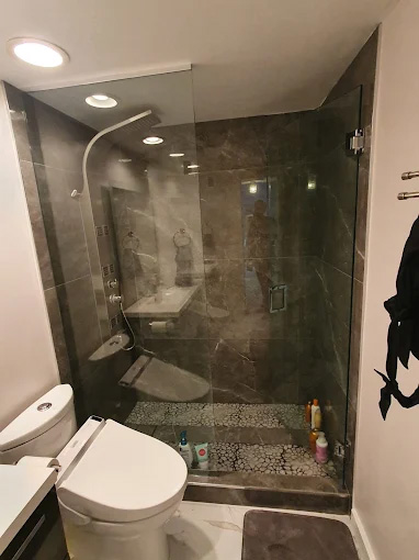 Walk-in shower with marble tile