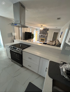 Open-concept kitchen renovation by Demi Construction